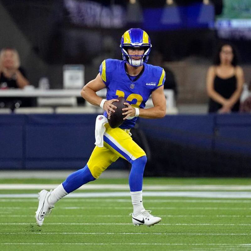 Los Angeles Rams quarterback Stetson Bennett (13) is sacked by Los